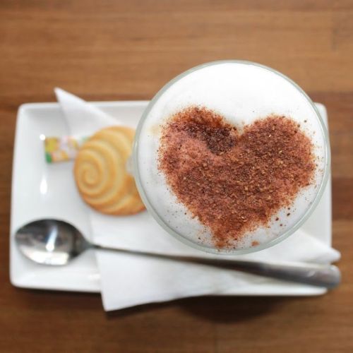 cappuccino on plate with cinnamon heart