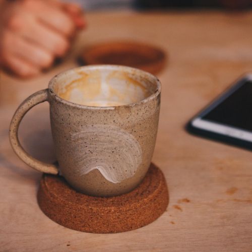 rugged brown coffee mug sitting on desk